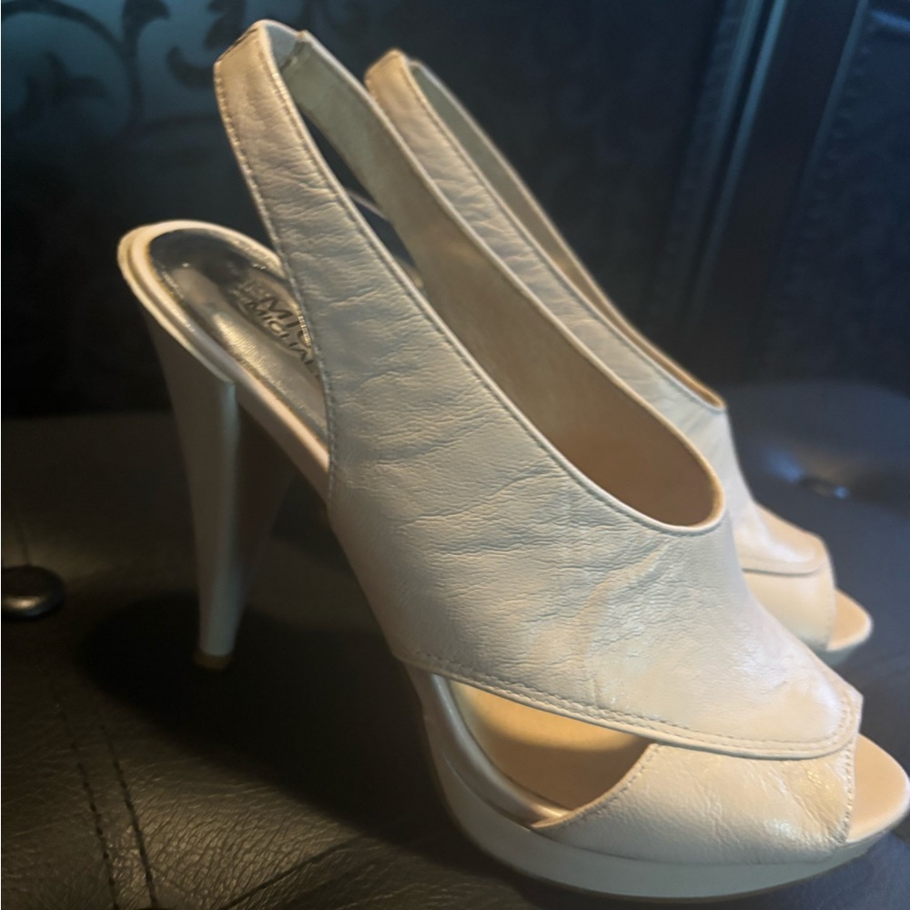 Michael Kors cream colored soft leather 4 1/2 inch heel slip on.